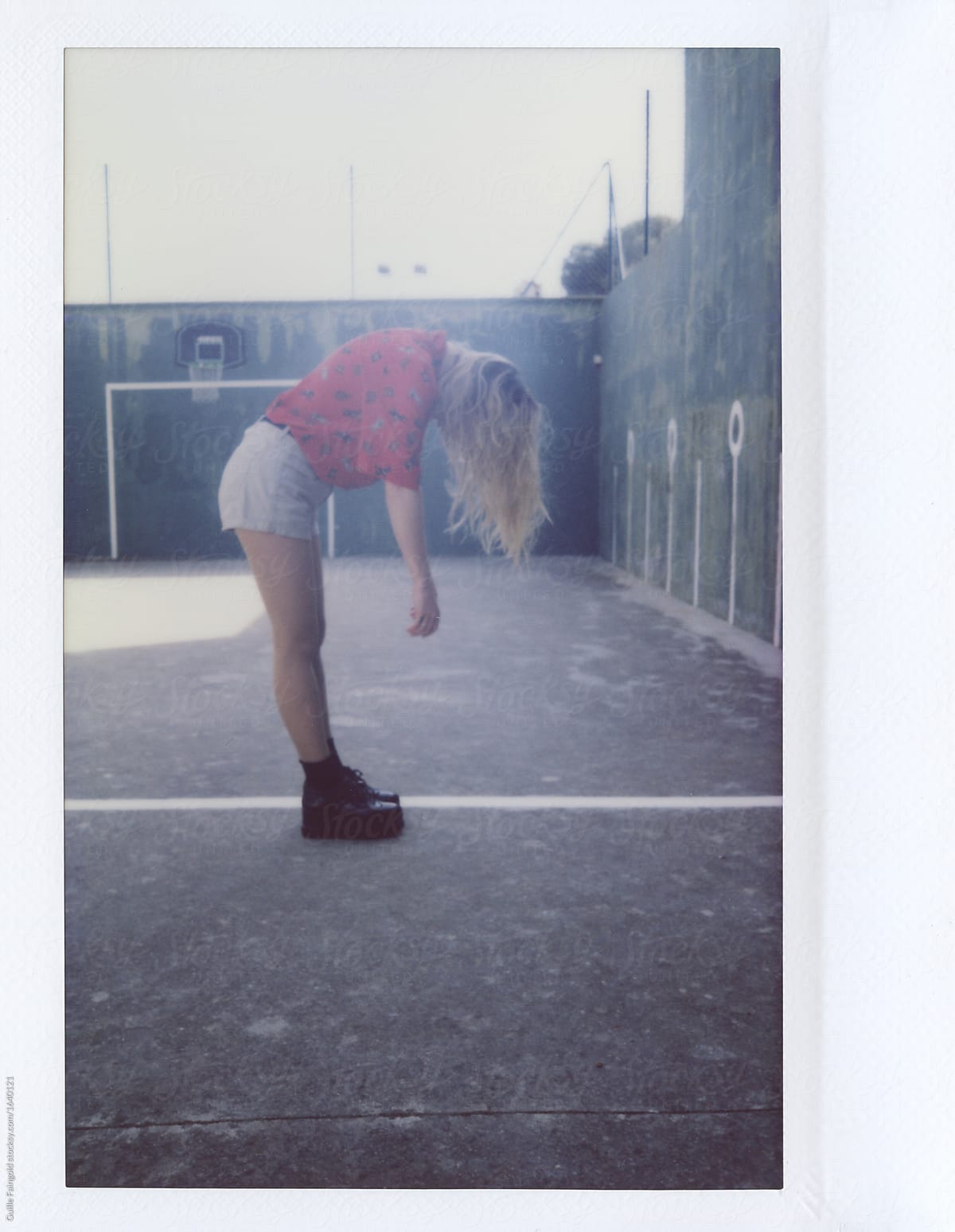 Blonde Girl In Shorts Bowing Down By Stocksy Contributor Guille Faingold Stocksy