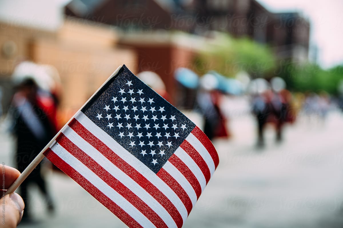 USA Flag Waved at A National Holiday Parade