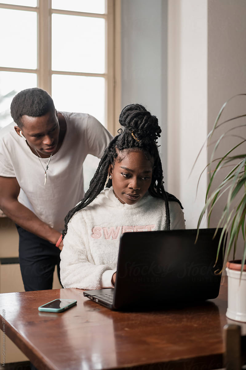 Black Couple using a laptop