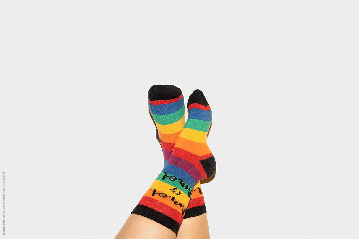 A anonymous person wearing rainbow socks - LGBT pride symbol
