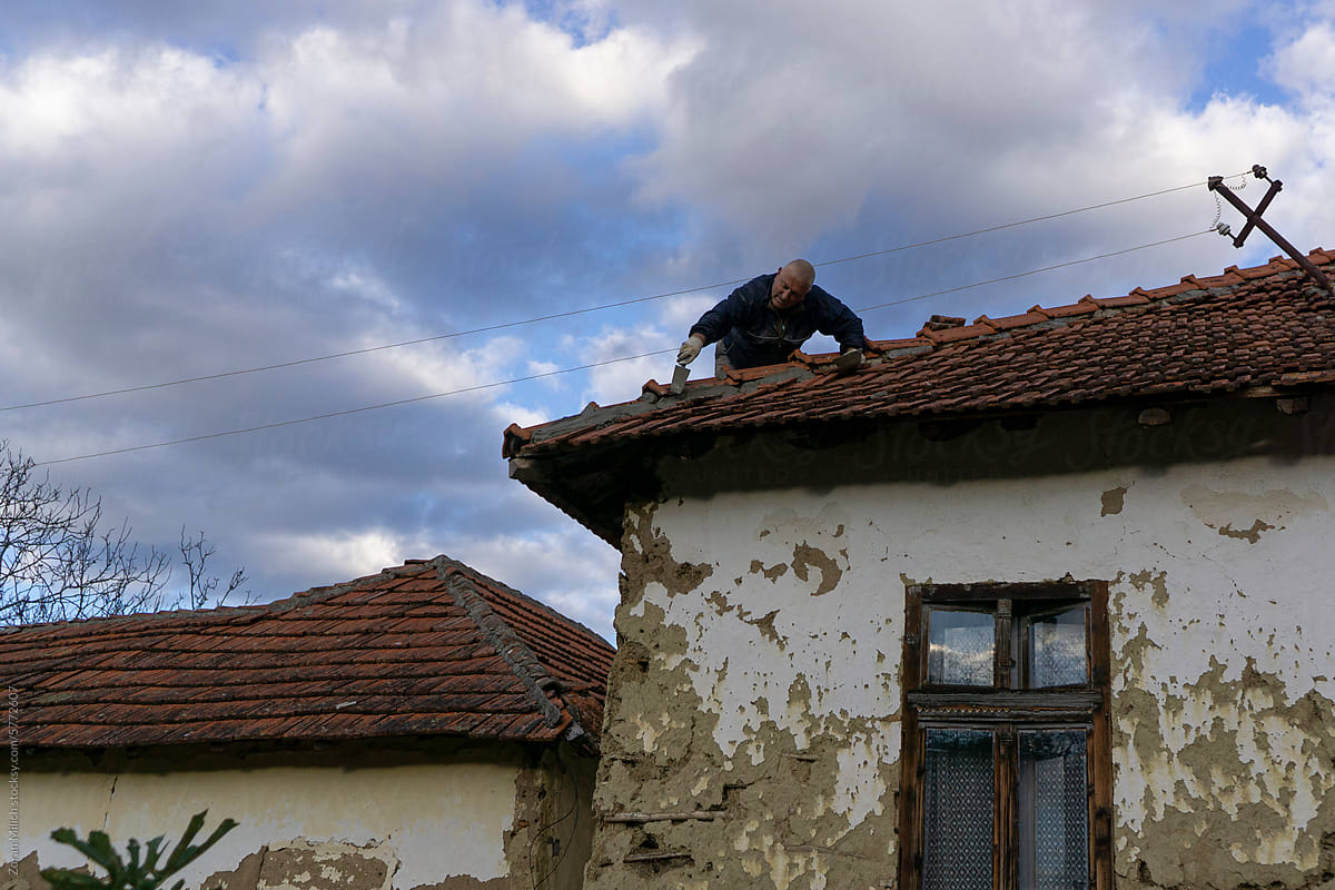 Man renovating a roof