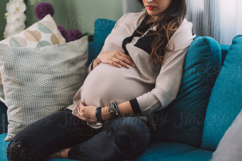Pregnant Woman Sitting  on a Couch
