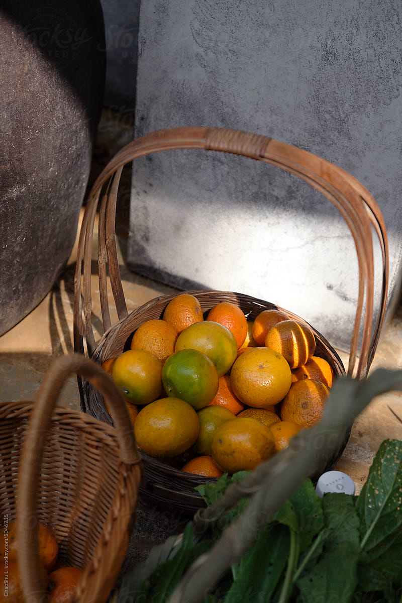 Closeup of freshly picked oranges in a basket