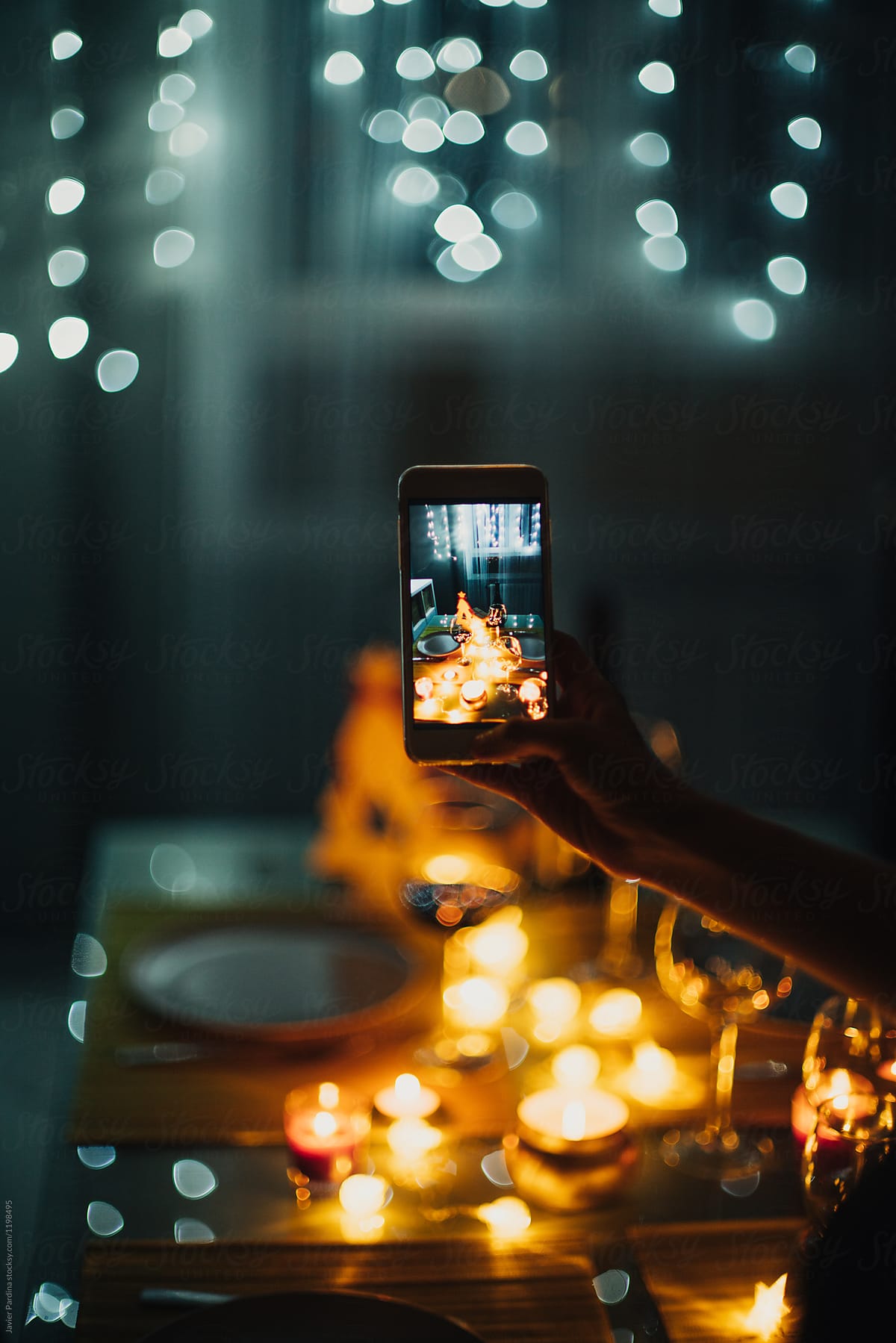 Taking picture of food and wine with cellphone