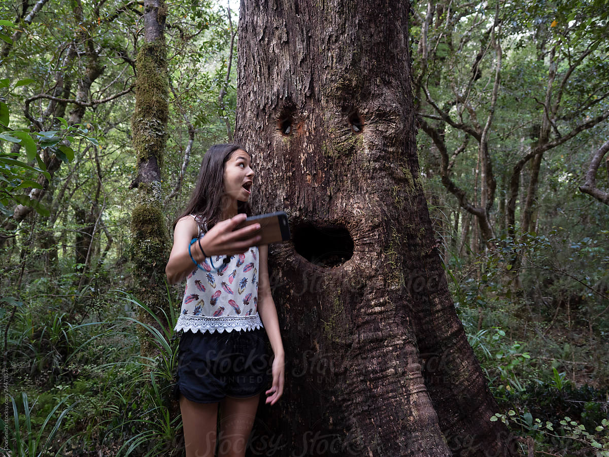 Selfie girl talking with fantasy tree