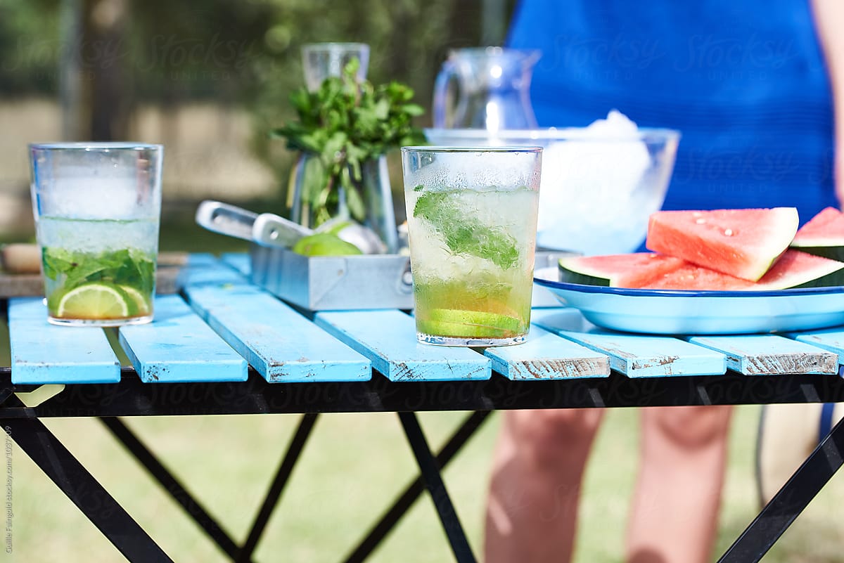 Close-up of outdoor bar with drinks and watermelon