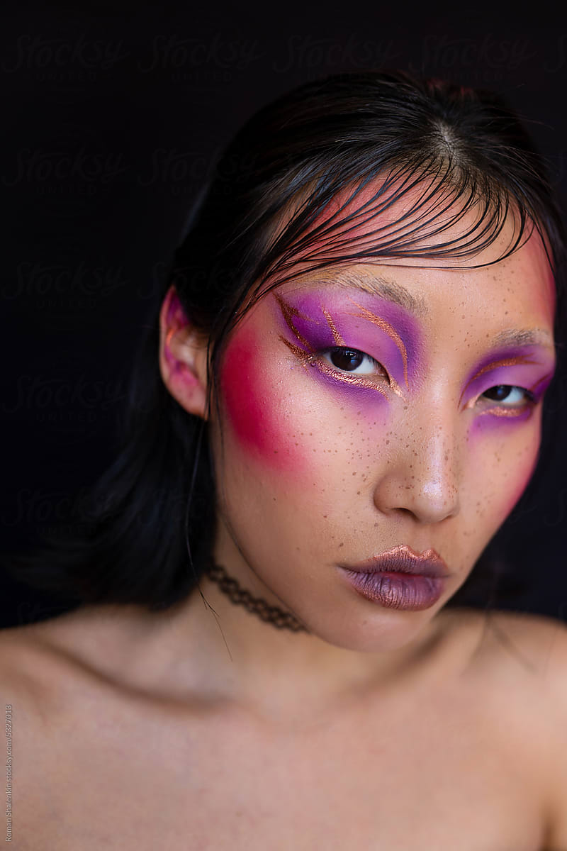 Bare woman with fashion pink makeup