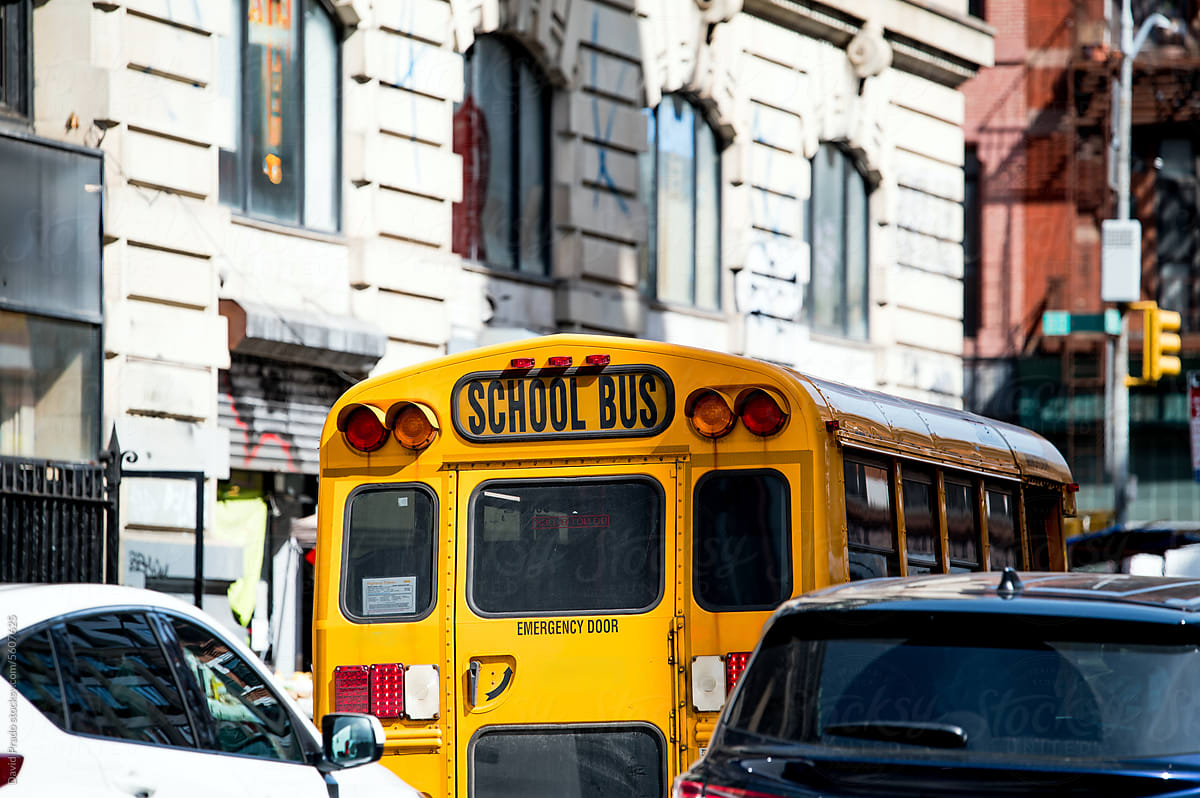 Bright yellow school bus on city street