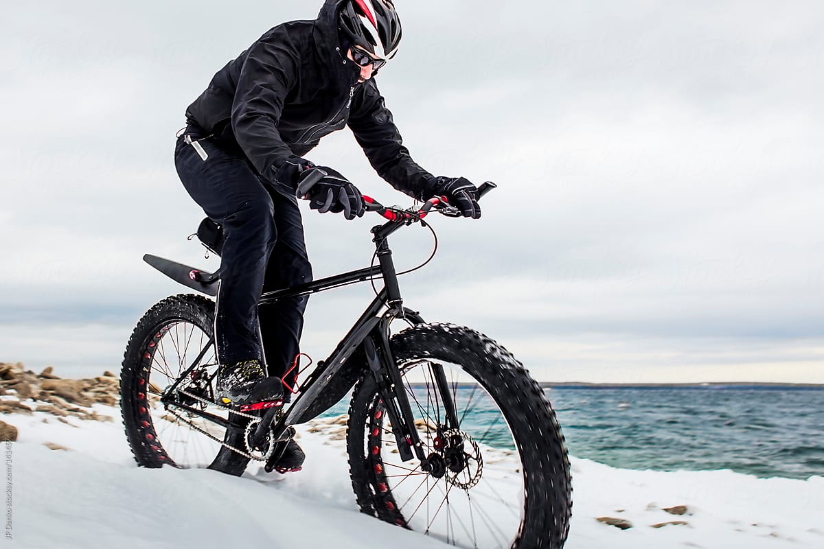 Extreme Winter Sport Mountain Biker Riding Fat Bike In Snow