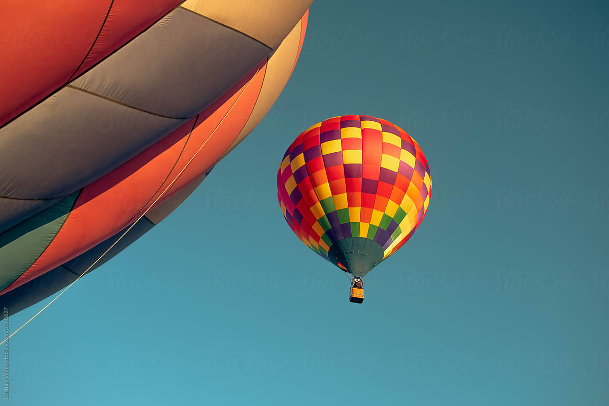 Hot Air Balloon Among Bright Blue Sky