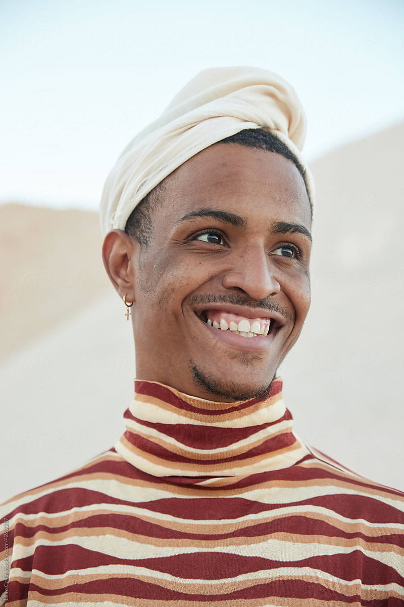 Portrait of a man smiling in desert