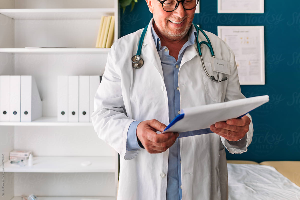 Male Physician Checking Documentation