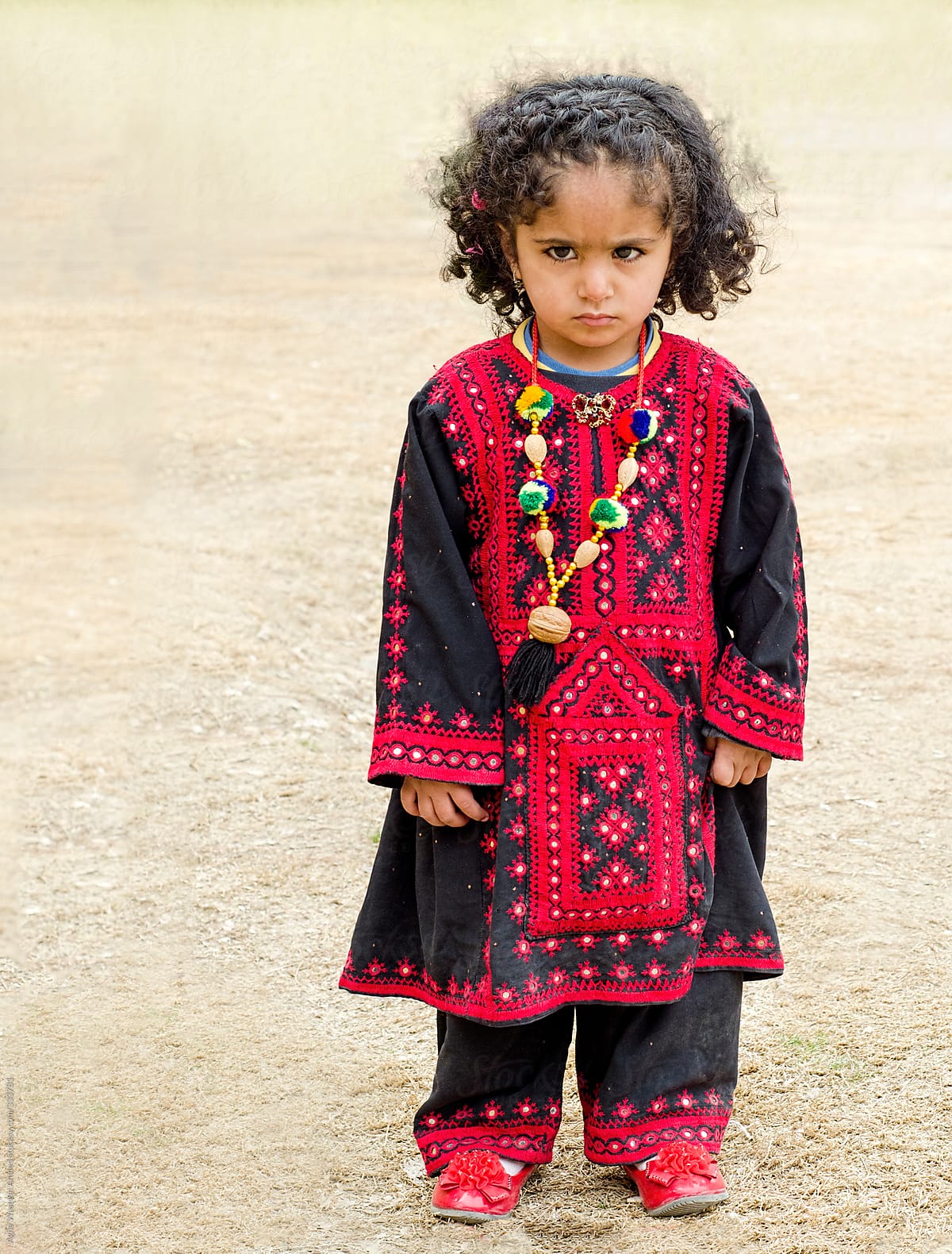 "A Balochi Girl Child" by Stocksy Contributor "Agha Waseem Ahmed" - Stocksy