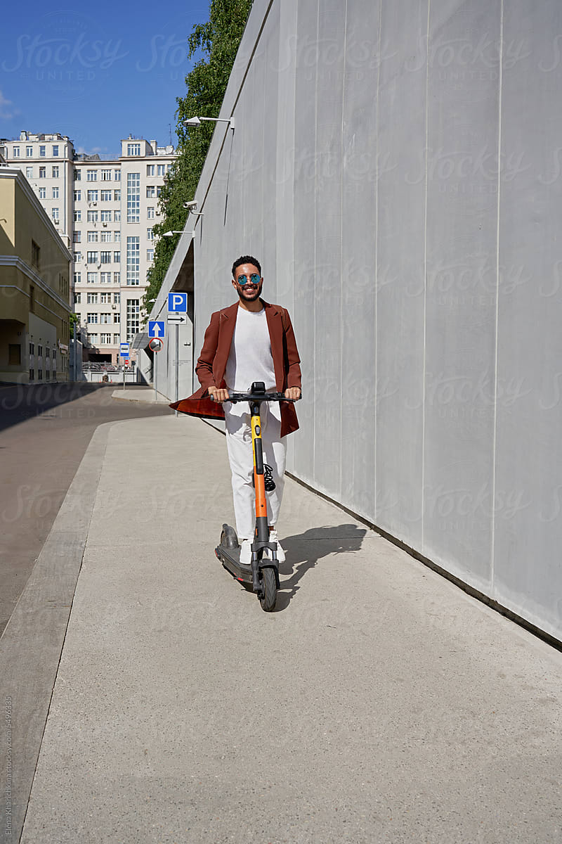 Black Man With Scooter.