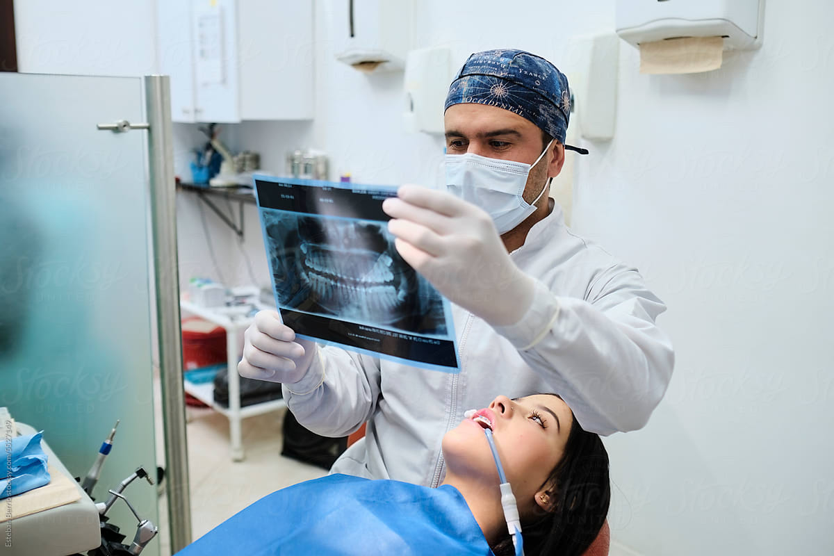 Dentist reviewing an x-ray of the patient