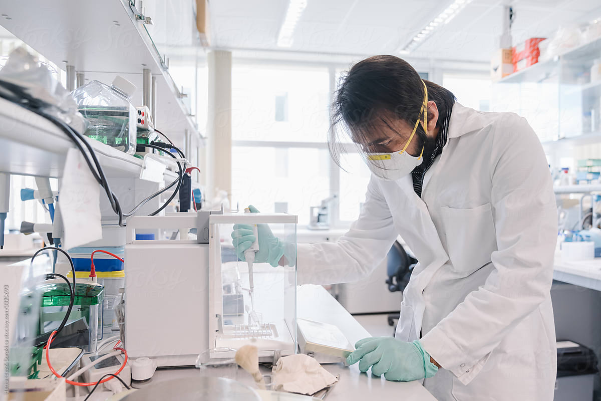 Researcher In High Protection Working At Laboratory
