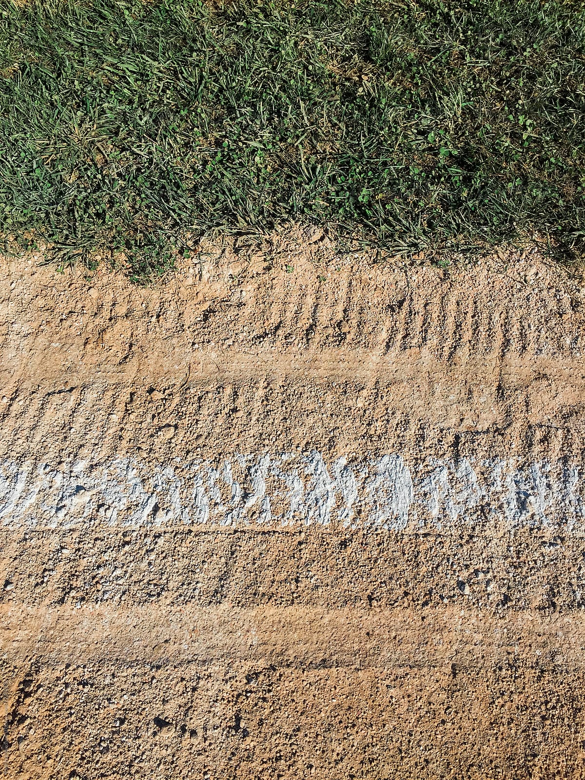 Close up of white boundary marks on baseball field
