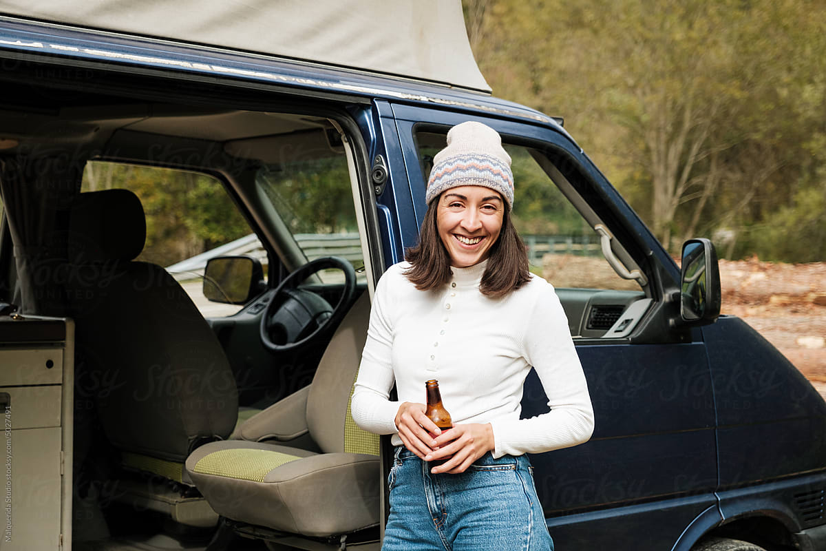 Woman enjoying road trip in camper van