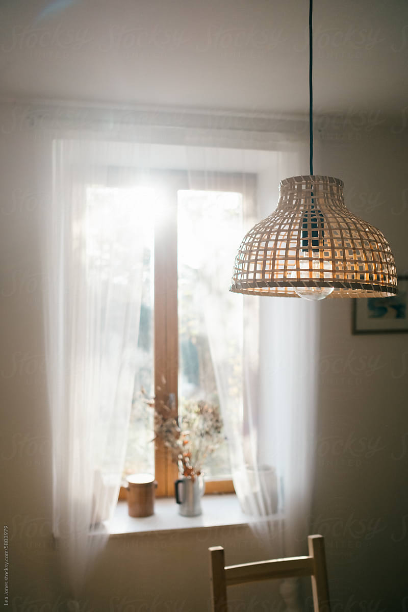 light shining through French windows in rustic kitchen