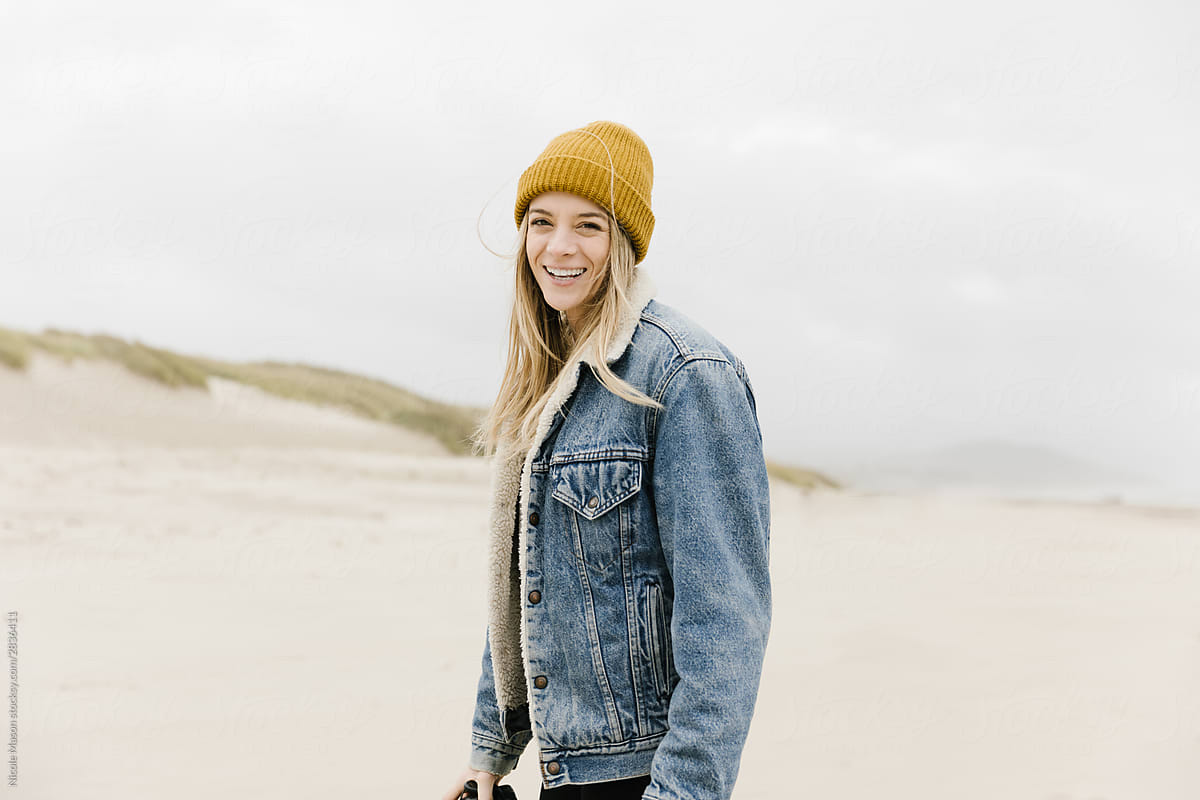 Young Woman Wearing Yellow Beanie And 