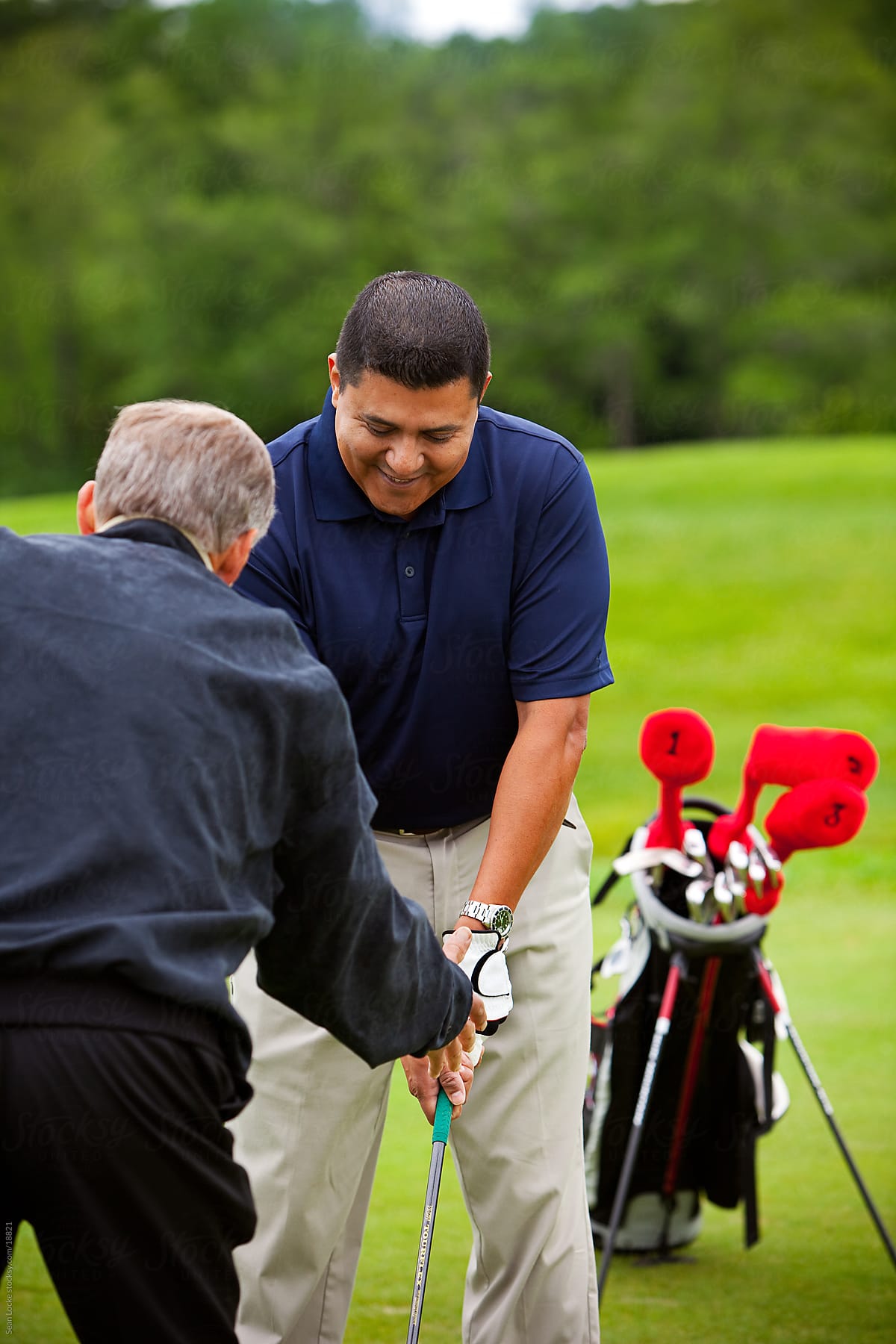 Golf: Golf Instructor Showing the Proper Technique