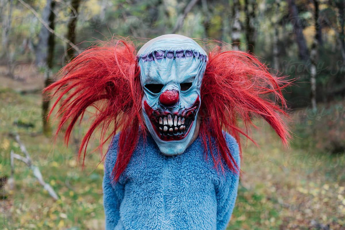 Creepy Clown Halloween Costume in Autumn forest