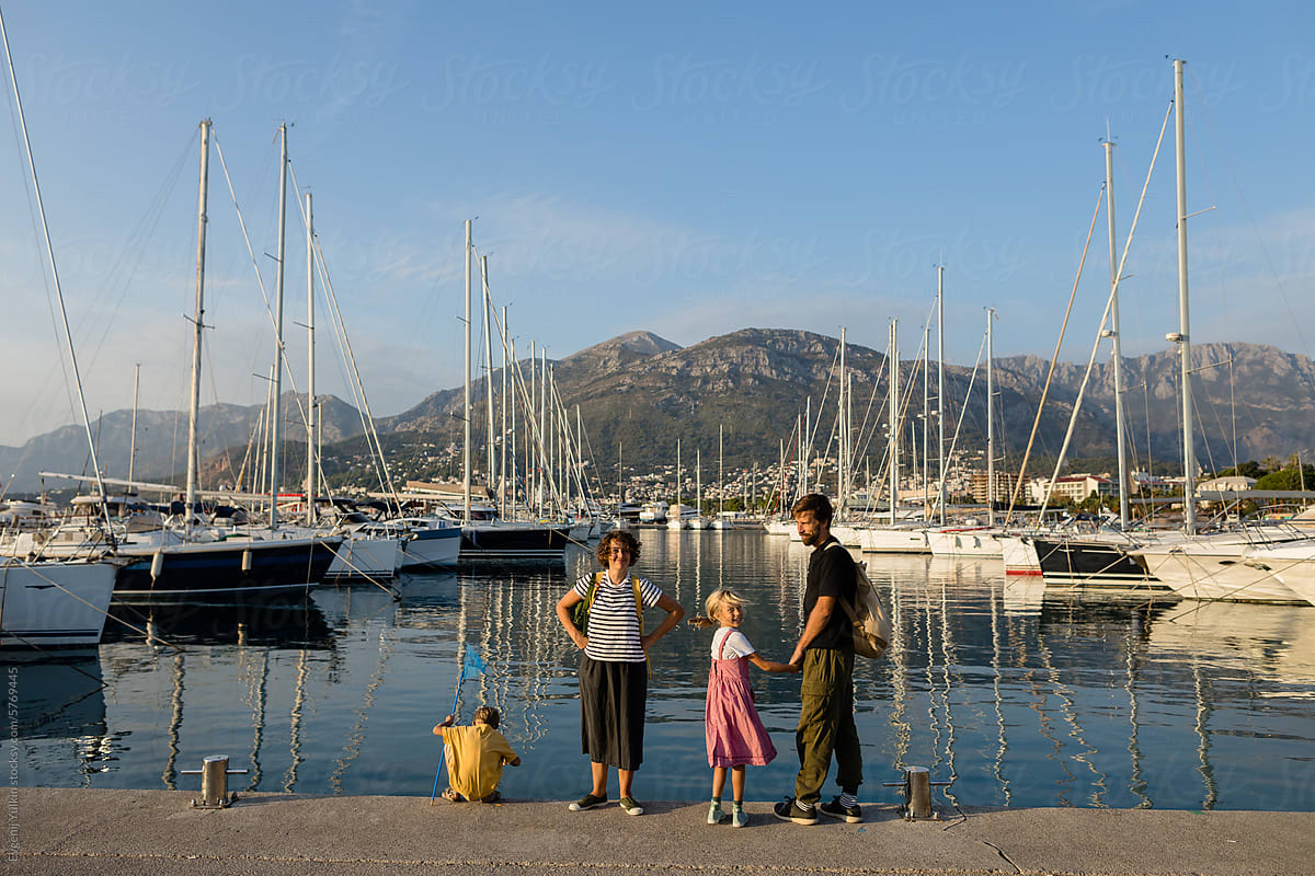 Family in the port at sunset
