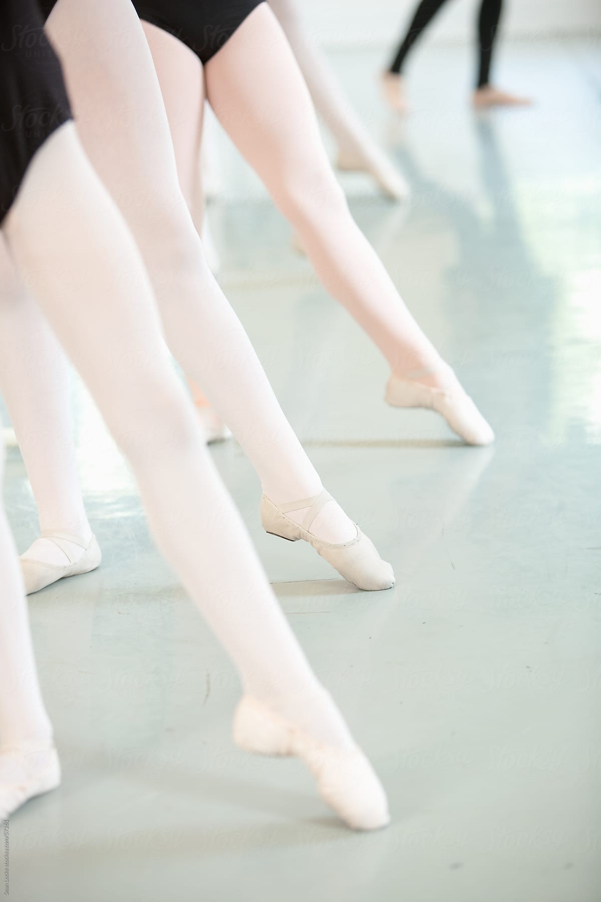 Ballet: Students Stretching Legs in Class