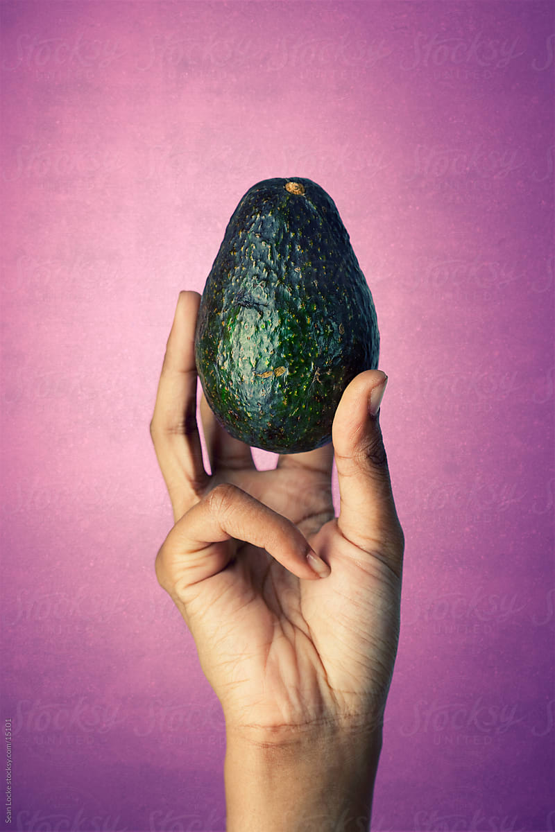 Healthy: Holding a Whole Avocado