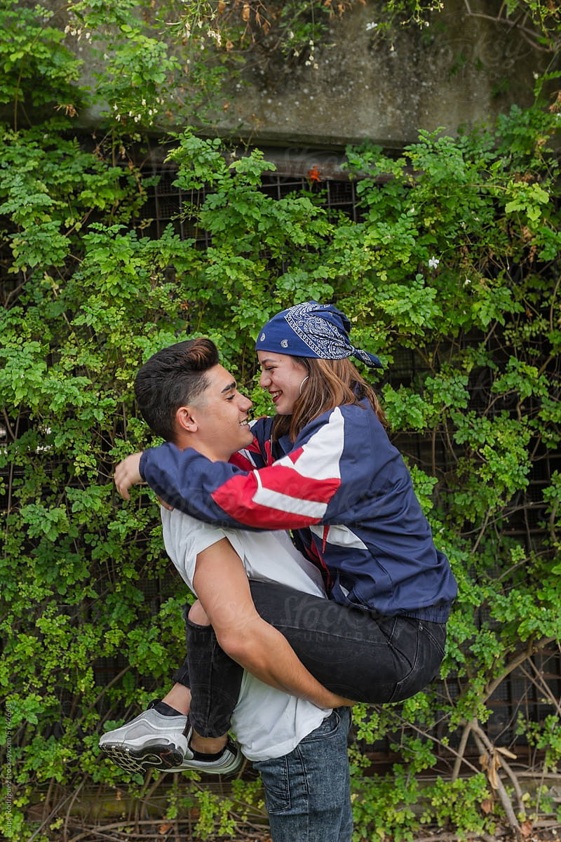 teenage couple hugging outdoors