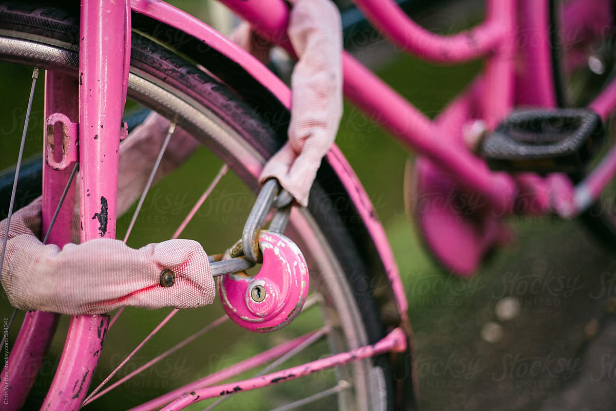 Pink bike lock and bike frame.