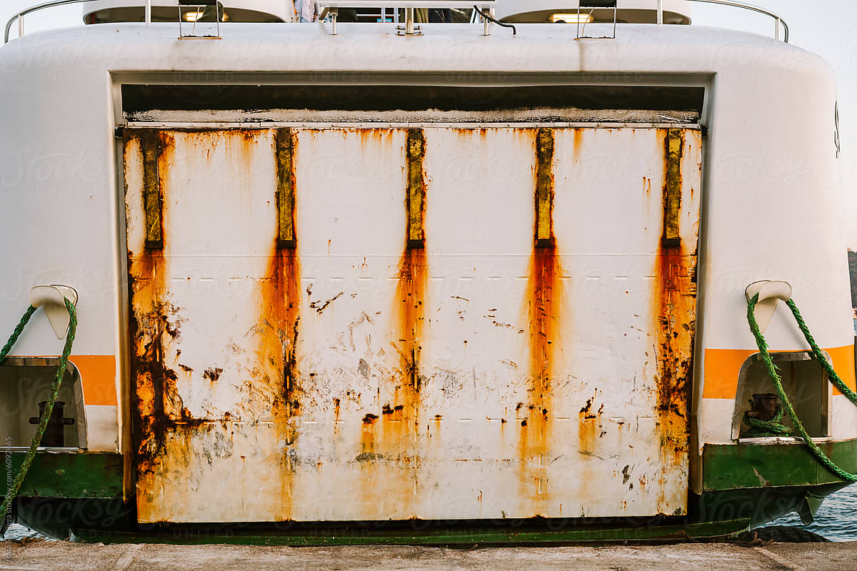 The ferry door with rust stains.