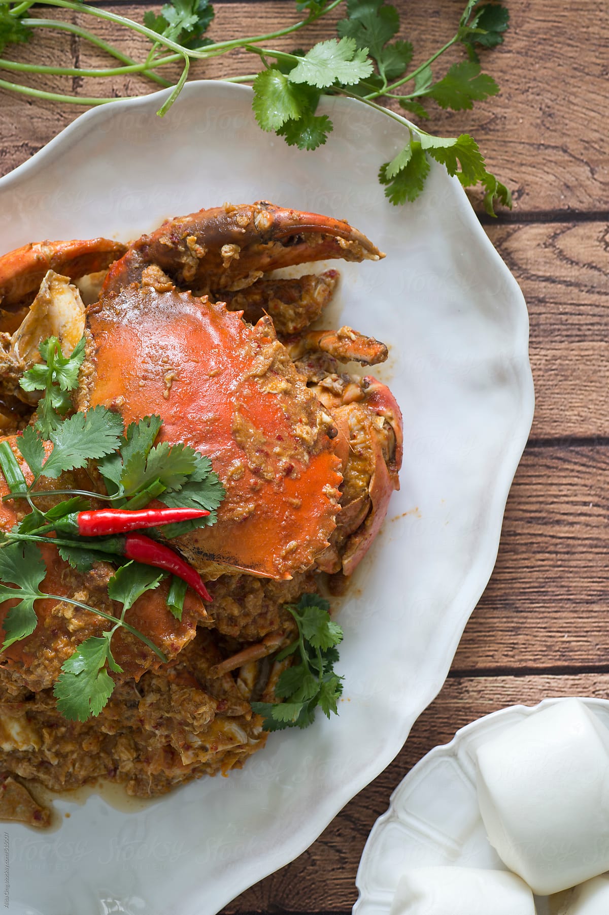 Chilli crab served with steamed bun