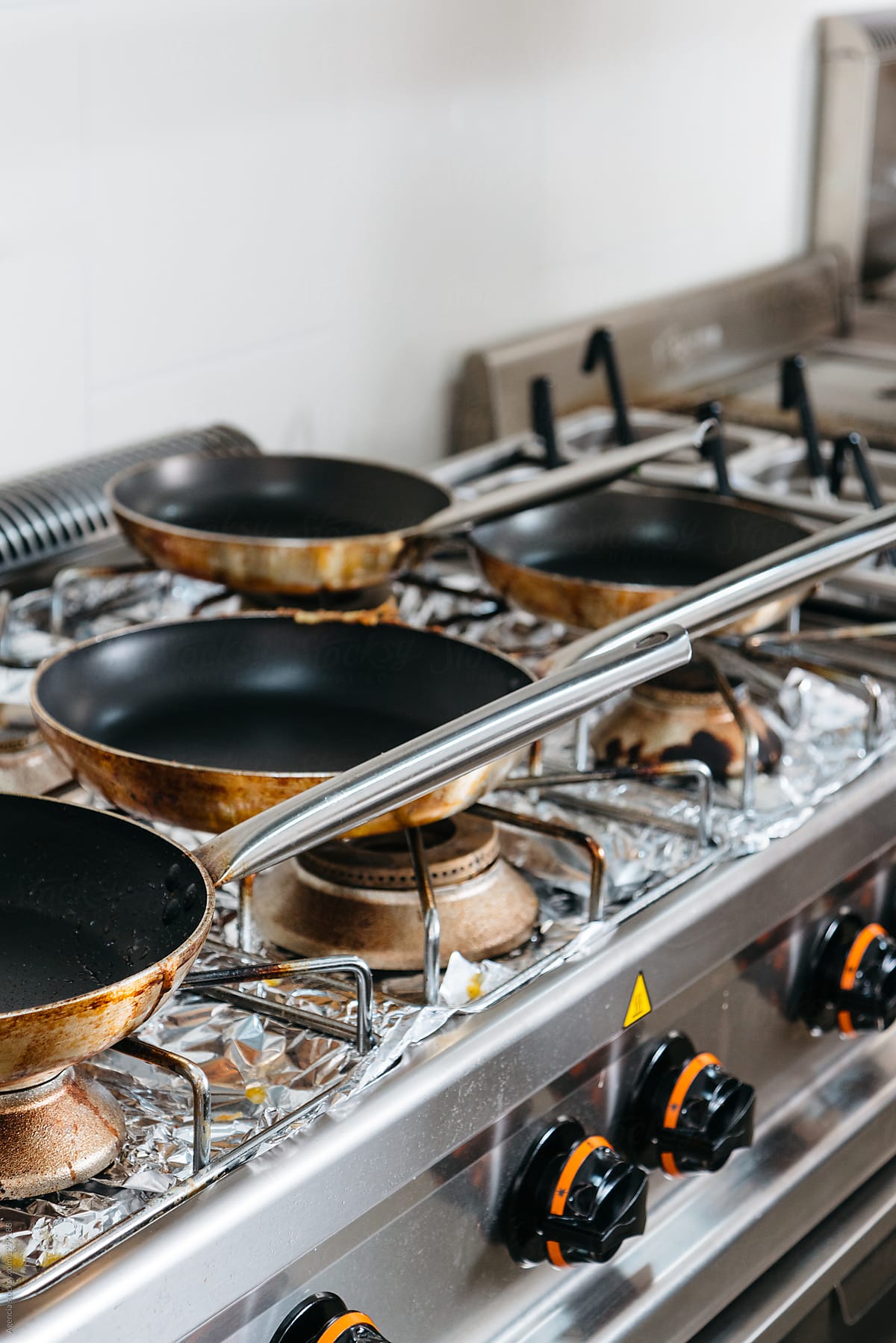 Pans In A Professional Kitchen by Stocksy Contributor Agencia - Stocksy