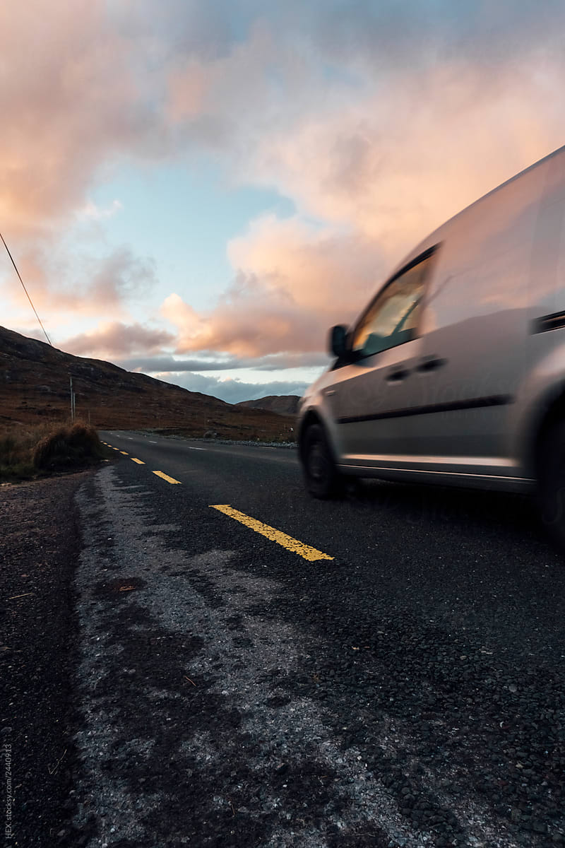 Van Driving Through the Landscape of The Connemara in Ireland during the Sunset