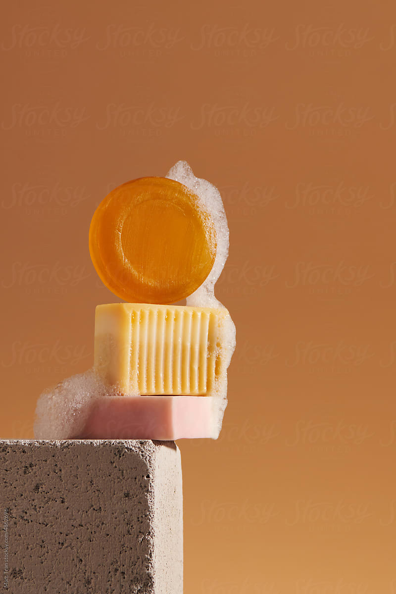 A bar of natural organic handmade soap with large bubbles of foam.