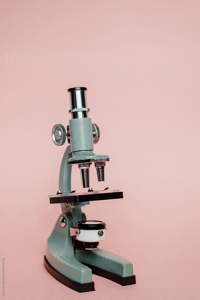 Small Microscope On A pink background