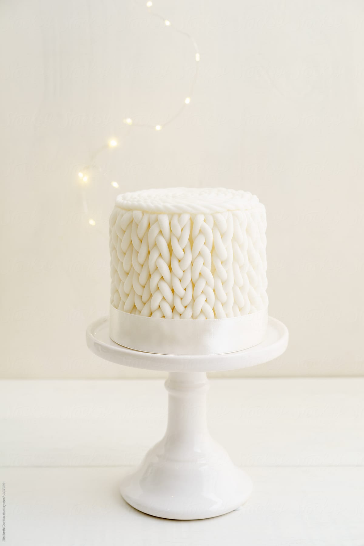 White Winter Cake With Knitted Pattern Made Of Fondant