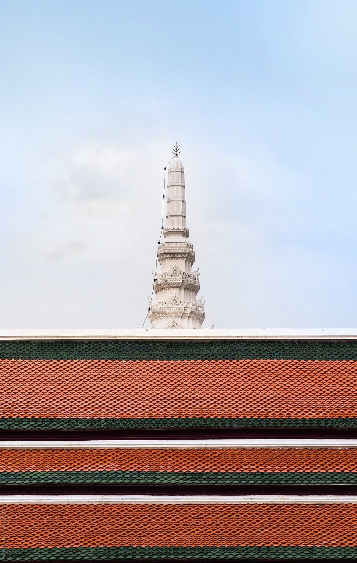 Colorful roofs with white monument/tower temple in background /Bangkok/Thailand