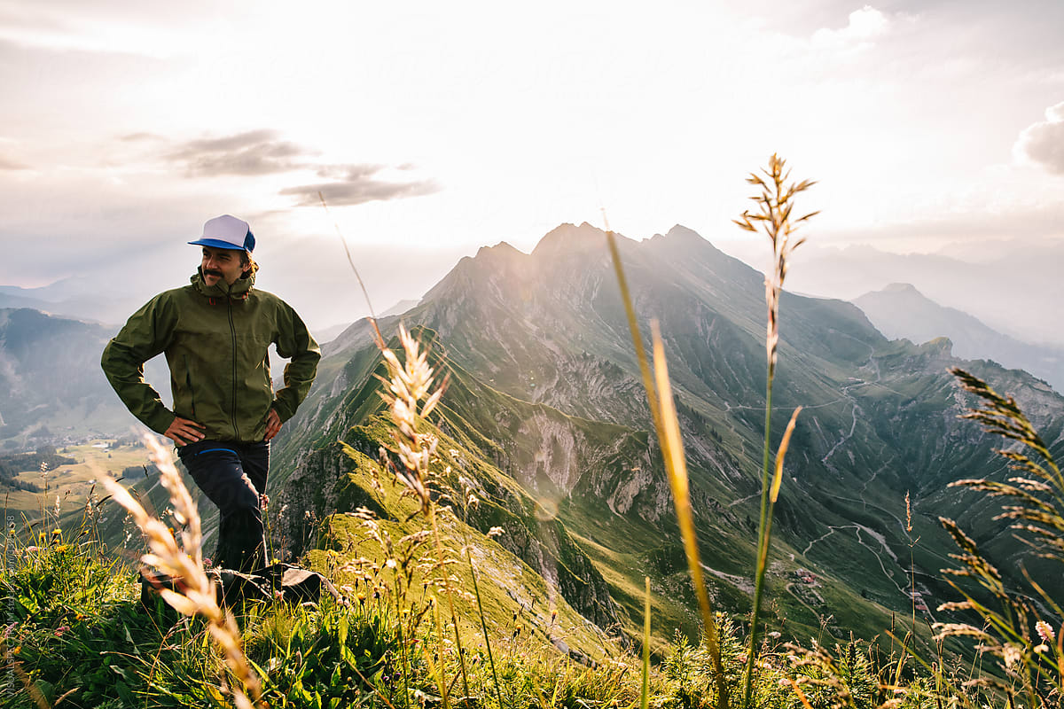 Man Enjoying Summer Morning Hike in Alps
