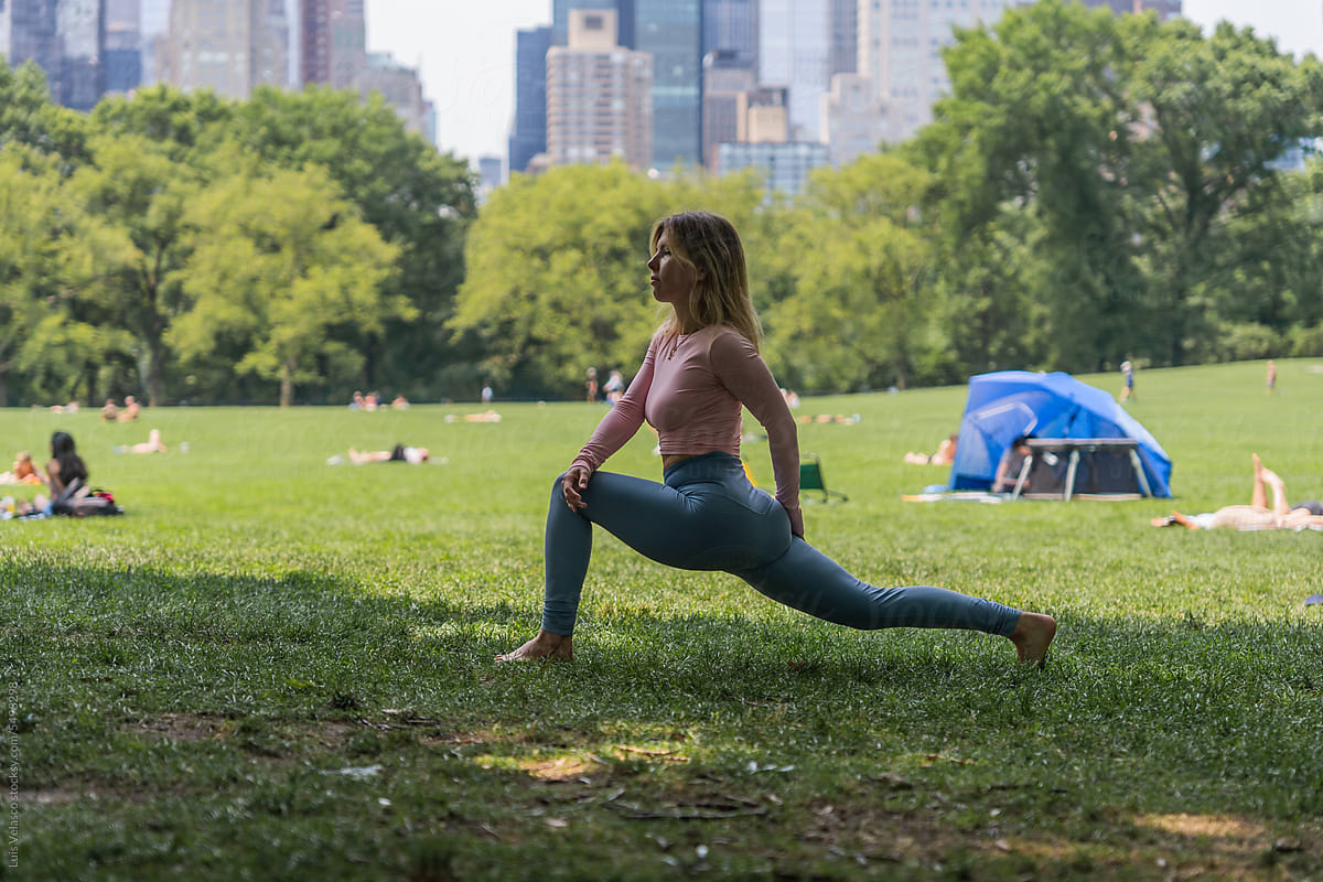Woman Doing Yoga In Central Park, NYC.