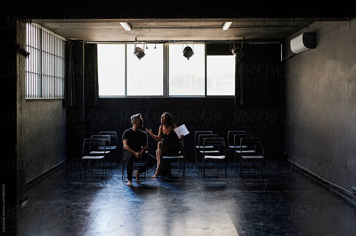 Mature actors conversating in a studio