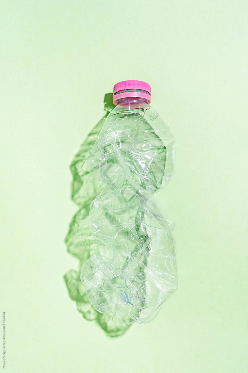 Plastic bottle on green background.
