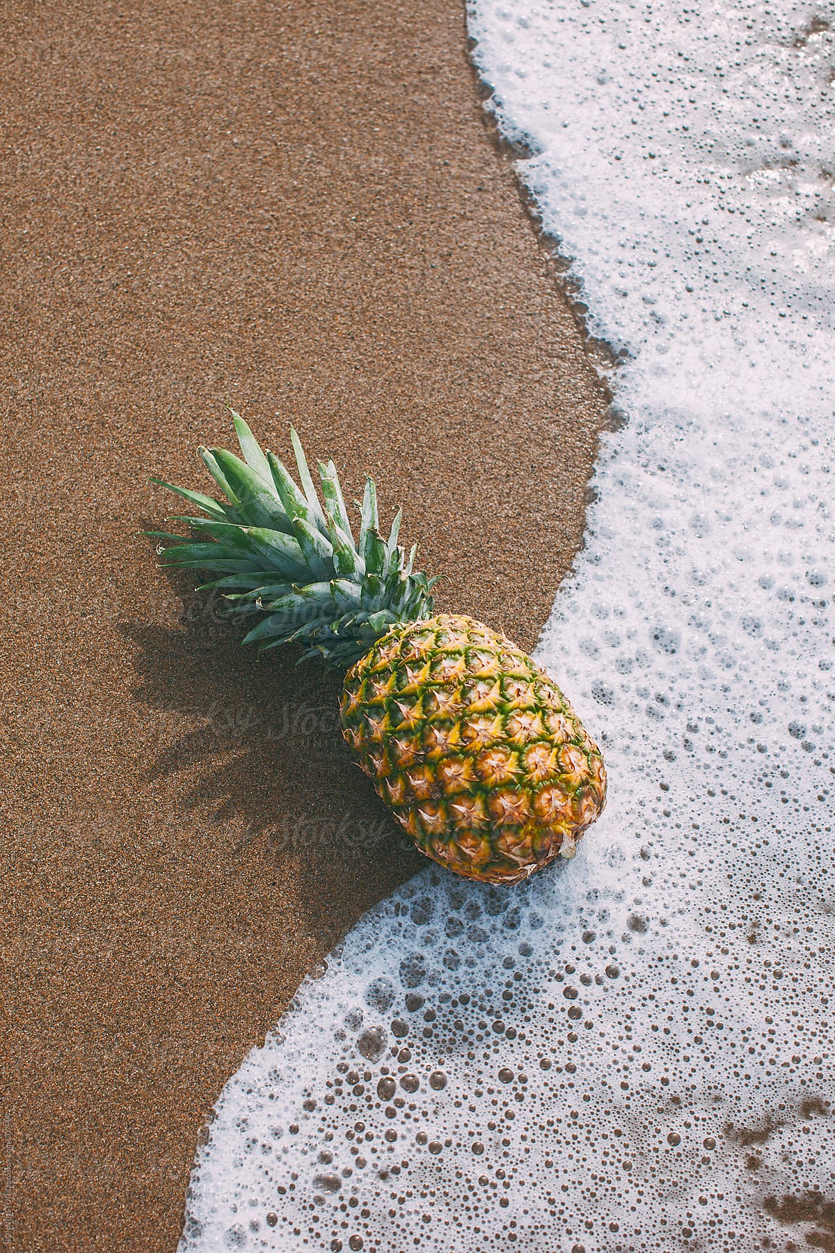 Pineapple on the beach. Summer time. by BONNINSTUDIO - Stocksy United