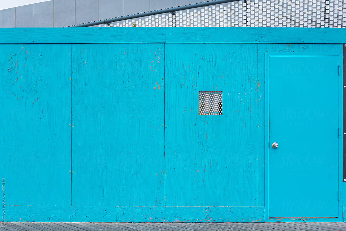 blue wooden wall with blue door