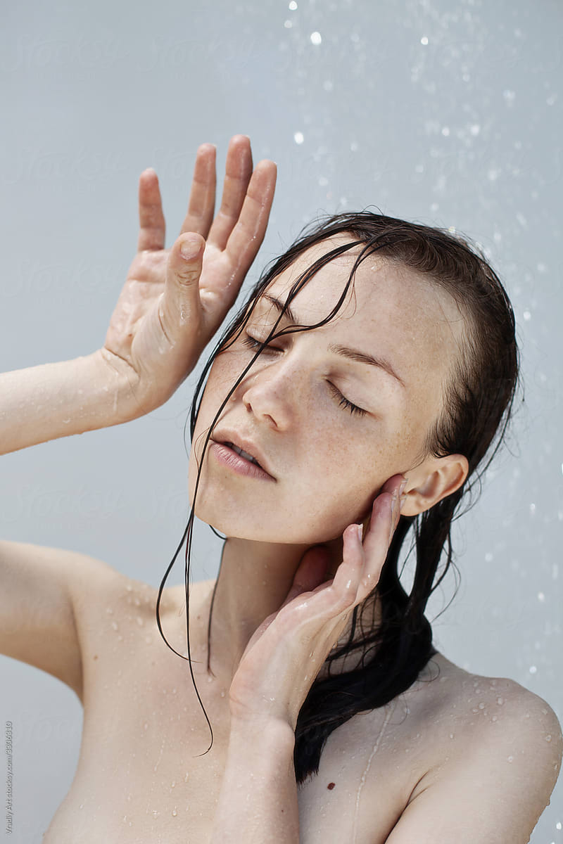 Young sensual woman in shower, Rain