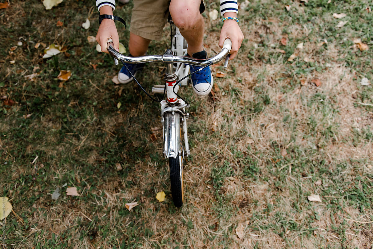 boy sitting on vintage bike