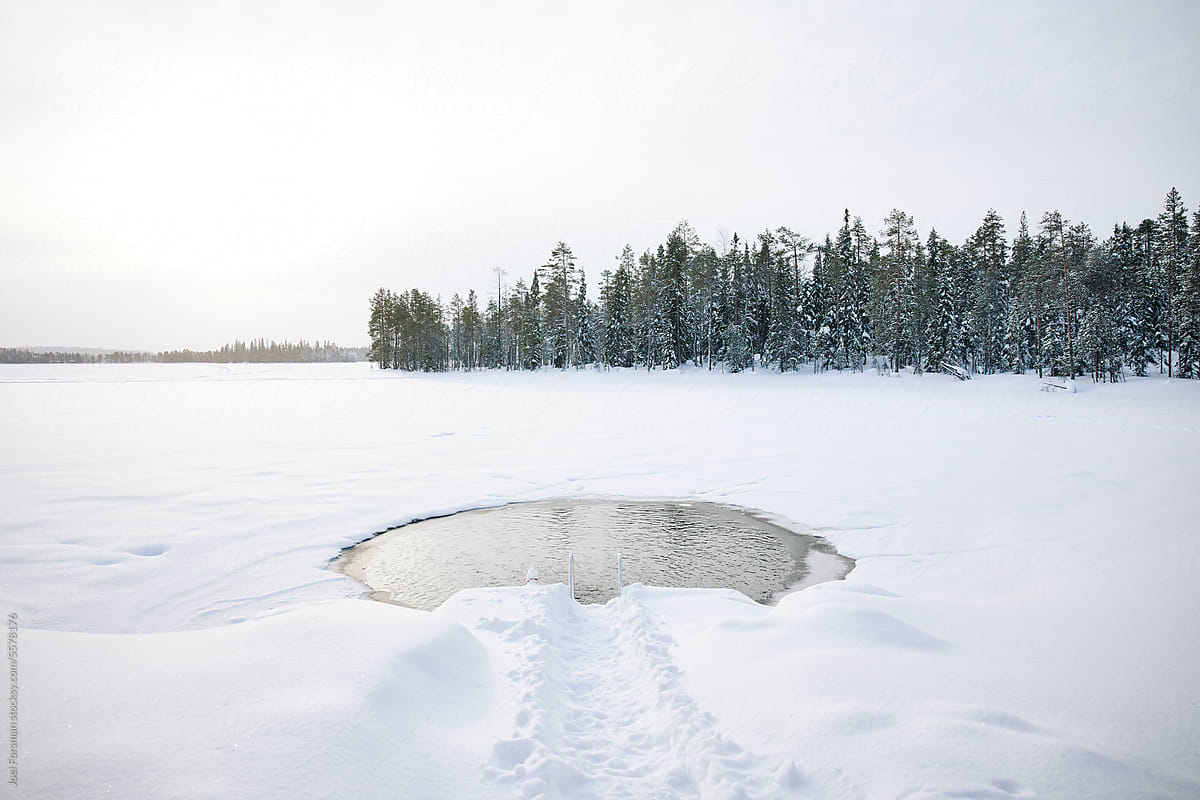 ice in the hole in lapland for swimming