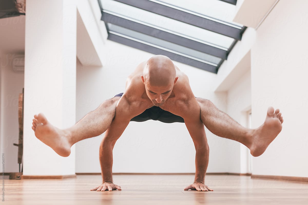 Yoga Man Prepare For Firefly Pose Tittibasana By Stocksy Contributor Borislav Zhuykov