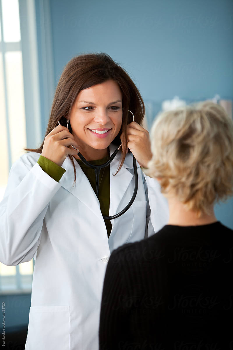 Exam Room: Physician Puts on Stethoscope